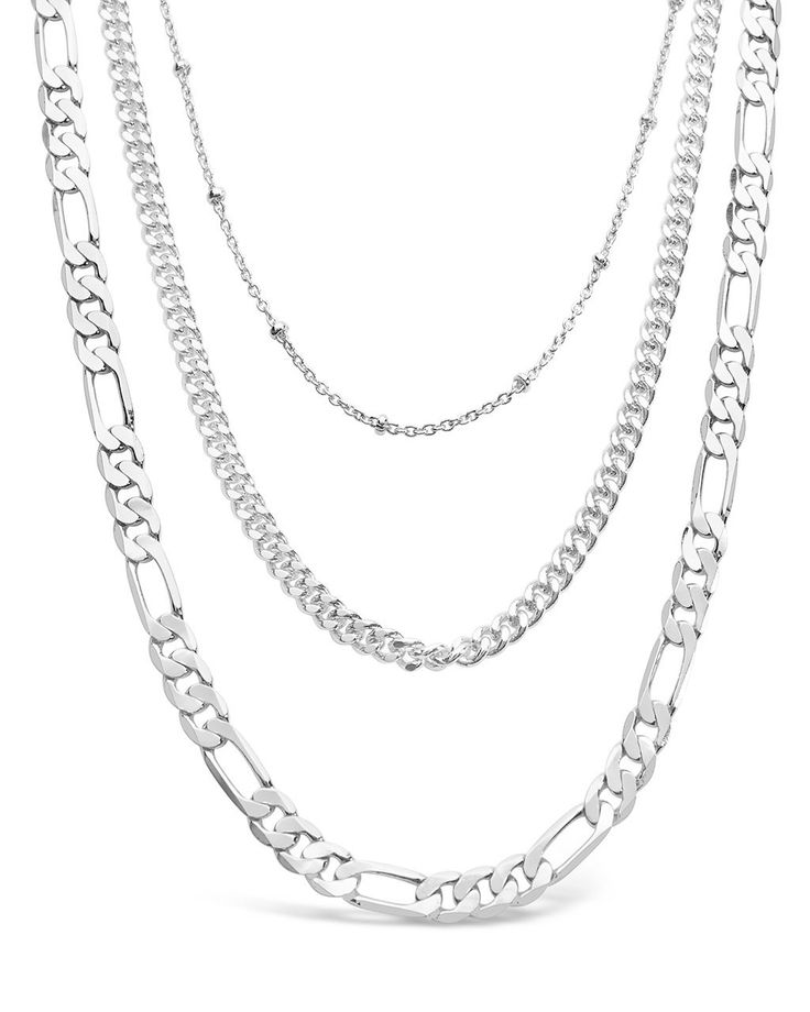 Layered necklaces are super on-trend, and these layered chains are sure to get you noticed everywhere you go! Choose between the gold and silver tones -- both are bright and bold, yet versatile enough to wear anywhere. Materials: 14K gold or rhodium plated brass Features: Measures 18-22" with 2" extender, 4.5mm Figaro chain, 3mm curb chain, 1mm beaded chain, Lead & Nickel free, lobster clasp Sliver Chain Necklace, Layered Chain Necklace Silver, Allsaints Jewelry, Silver Necklaces Layered, Silver Layered Necklaces, Silver Chain Jewelry, Silver Necklace Chain, Trending Bracelets, Necklaces Silver