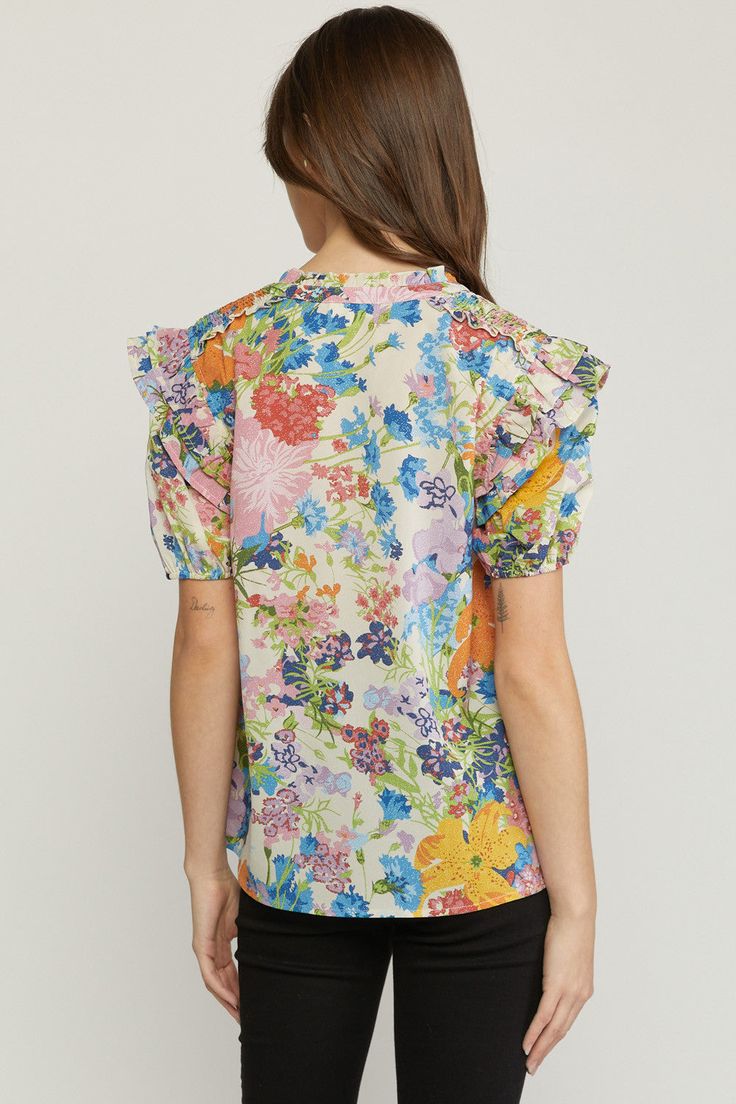 This top has a floral pattern that you will love! Its simple & comfy fit make it so easy to style for work or play! This top features a V-neckline with a self tie closure at the neck, short sleeves with elastic, smocking on the shoulders, ruffle detailing on the shoulders, neck & sleeves, has a soft & silky fabric and an a-line silhouette. We like it paired with a denim jacket for a casual look or a leather jacket for an edgier vibe. Small Bust 38" Length 25" : Medium Bust 40" Length 25" Large B Tulip Top, Ruffle Sleeve Blouse, Tangerine Orange, Silky Fabric, Floral Ruffle, Comfy Fits, Small Bust, V Neck Tops, Short Sleeve Top