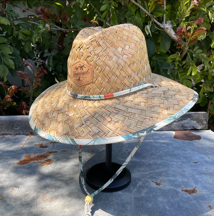 If you like to spend plenty of time at the beach or pool, this straw hat is a must have. Features an adjustable chin cord, funky printed underbrim, and an elastic sweatband for all day comfort. Sizes: M/L - 59cm L/XL - 61cm Adjustable Coastal Straw Hat Made Of Toquilla, Adjustable Sun Hat For Vacation, Casual Upf 50+ Hat Bands For Outdoor, Casual Adjustable Natural Hat, Natural Casual Hat With Adjustable Fit, Casual Straw Hat For Vacation, Casual Toquilla Straw Hat For Outdoor, Casual Straw Hat For Warm Weather Outdoor, Casual Toquilla Straw Hat Bands For Outdoor