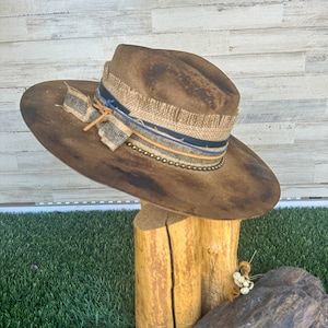 Montana Decorated Hat Form 59 Cm - Etsy Rustic Adjustable Distressed Hat Bands, Rustic Distressed Hat For Western-themed Events, Rustic Distressed Hat With Flat Brim, Rustic Wide Brim Distressed Hat, Artisan Fedora For Western-themed Events, Rustic Distressed Brown Fedora Hat Bands, Rustic Handmade Fedora With Flat Crown, Rustic Handmade Ranch Hat, Rustic Distressed Brown Fedora Hat