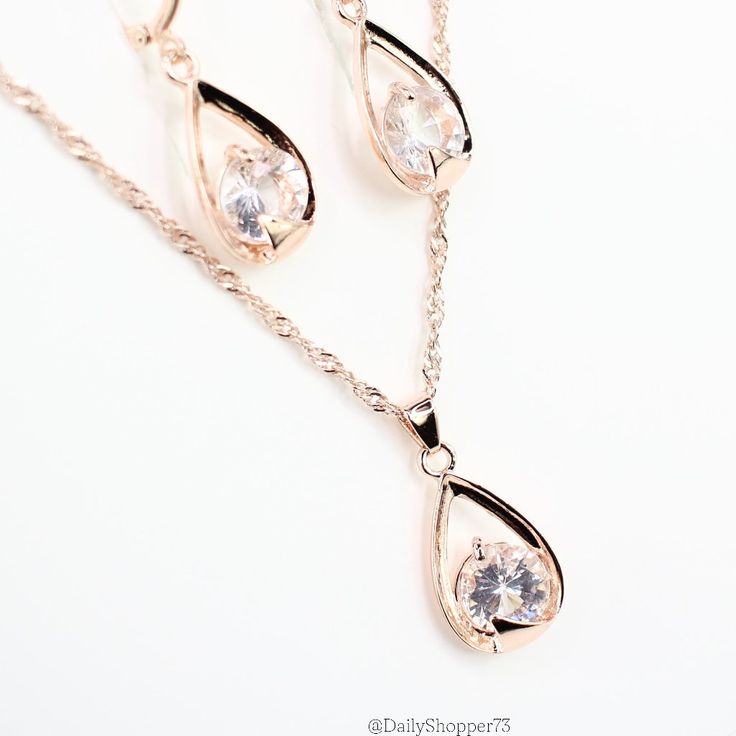 This Is A Beautiful Women's Rose Gold Tone Round Cut Point End Solitaire Necklace And Drop Earrings Set. It Features A Super Sparkly Round Cut Acrylic Rhinestone On A Singapore Twist Chain, Lobster Clasp, And Matching Earrings. All Orders Are Packaged With And Are Shipped Out Asap! Questions? Leave Us A Comment! We Are More Than Happy To Help! New To Poshmark? Use The Invite Code Dailyshopper73 When You Create Your Account For $10 Off Your First Purchase! Feminine Teardrop Jewelry For Party, Feminine Dangle Rose Gold Jewelry, Feminine Rose Gold Dangle Jewelry, Rose Gold Dangle Jewelry Sets With Matching Earrings, Elegant Rose Gold Jewelry Sets For Valentine's Day, Feminine Rose Gold Jewelry With Matching Earrings, Party Rose Gold Dangle Jewelry Sets, Feminine Pink Gold Jewelry For Party, Pave Heart Necklace