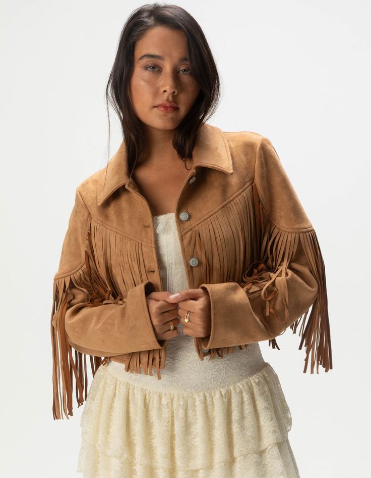 West Of Melrose Fringe Jacket. Make A Statement With This Faux Suede Fringe Jacket, Featuring A Stylish Button Front And Chic Fringe Detailing. The Soft Faux Suede Adds A Luxurious Touch, While The Fringe Brings A Fun, Bohemian Vibe. Cropped Fit. 92% Polyester, 8% Spandex. Machine Wash. Imported. Model Is Wearing A Size Small. Model Measurements:height: 5'7" Bust: 34"waist: 25"hips: 34.5" 70s Fringe Jacket, 70s Fringe, Overalls Boys, Chino Pants Women, Wwe T Shirts, Flannel Sweatshirt, Suede Fringe Jacket, Girls Graphic Tee, The Fringe