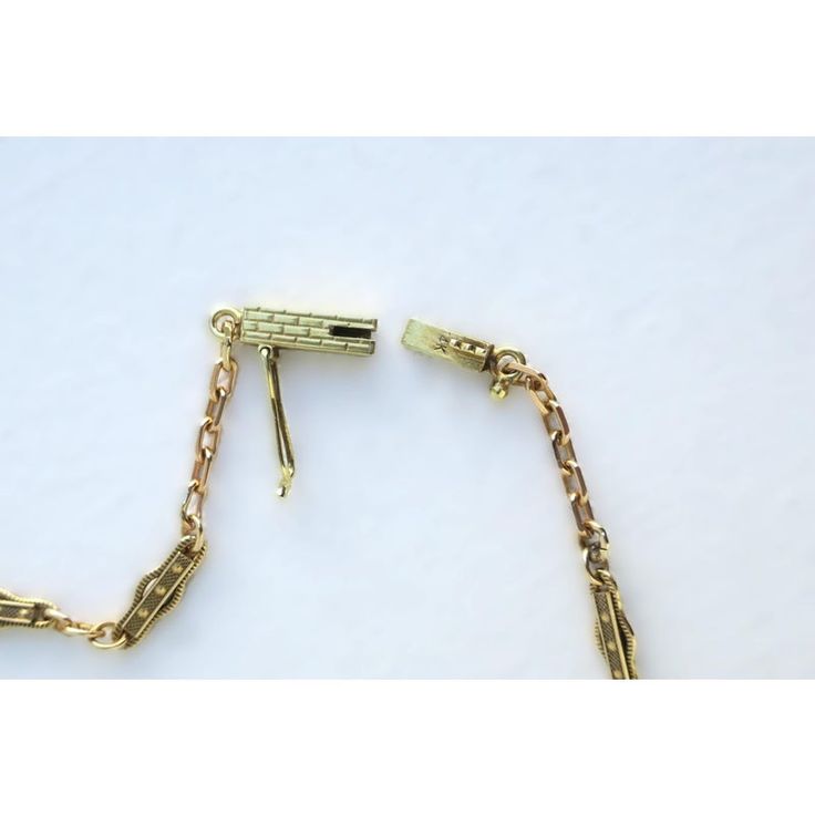 This is part of Chairish’s Fine Jewelry assortment.  A beautiful, elegant, detailed, strong, and well-made choker necklace in 14-karat yellow gold, circa mid to late-20th century. Necklace has beautiful, detailed chain links and detailed bar clasp. A chic vintage piece to wear alone or stack with other necklaces, dress up or down. Very good condition as shown in images. No issues. Marked '14k' on clasp. A true choker necklace measuring: 13.88" long.  Emerald stud earrings (in ear) are also avail Elegant Brass Jewelry With Figaro Chain, Formal Yellow Gold Chain Necklace With Gold Clasp, Vintage 14k Gold Chain Necklace For Formal Occasions, Elegant Brass Necklace With Figaro Chain, Timeless Formal Chain Necklace With Lobster Clasp, Elegant Yellow Gold Chain Necklace With Lobster Clasp, Elegant Chain Necklace With Gold Clasp As Gift, Formal Adjustable Brass Chain Necklace, Antique Figaro Chain Necklace For Formal Occasions