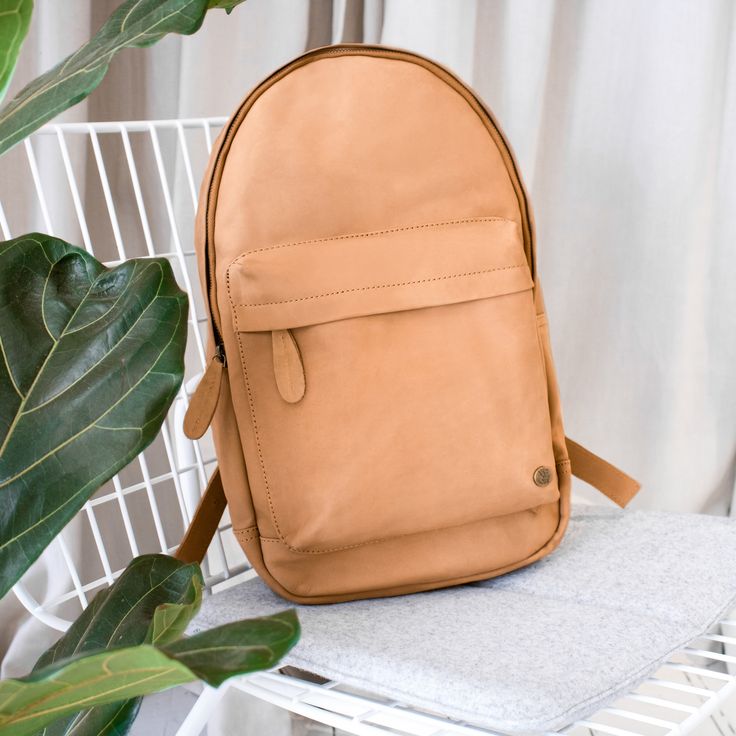 Premium suede leather backpack in a soft vintage cognac colour.   Every MAHI is handmade to order can be personalised and comes complete with a complimentary dust cover, 1 year warranty and 30 day money-back guarantee. $1.50 from every sale is donated to FRANK Water. Classic Backpack With Leather Handles For Daily Use, Cognac Leather Backpack Satchel For Everyday, Classic Cognac Backpack For Travel, Casual Everyday Bags With Leather Lining, Classic Cognac Travel Backpack, Cognac Backpack With Adjustable Strap, Cognac Backpack With Adjustable Strap For Daily Use, Classic Everyday Backpack With Leather Handles, Cognac Leather Travel Backpack