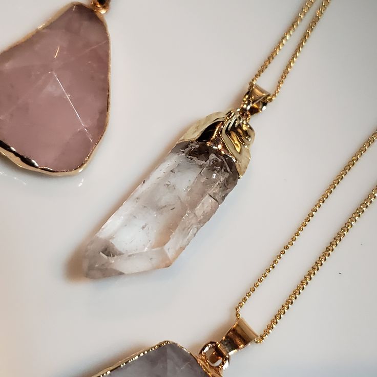 "~Quartz Pendants -Gold Plated -Natural Quartz Crystal -Chain Included: 16-in gold plated curb chain, with clasp -Sizes Vary: Irregular Shaped Charms: L. 40-65mm x W. 25-50mm Clear Quartz Point: L: 38x20mm W: 23x14mm ~Quartz Crystal Options: 💎Clear Quartz💎 - High vibration stone, one of the most healing stones of all. It amplifies, restores, releases and stores energy. Helps clear mental blocks and improves focus. 💜Amethyst💜 Powerful stone that promotes peace, stability, and calmness. It is Gold Rose Quartz Jewelry For Jewelry Making, Rose Quartz Gemstone Gold Jewelry, Gold Rose Quartz Gemstone Jewelry, Gold Rose Quartz Pendant Jewelry, Gold Jewelry With Rose Quartz Gemstone, Gold Gemstone Jewelry With Rose Quartz, Gold Rose Quartz Gemstone Crystal Necklace, Gold Rose Quartz Crystal Necklace, Gold Crystal Necklace With Rose Quartz Gemstone