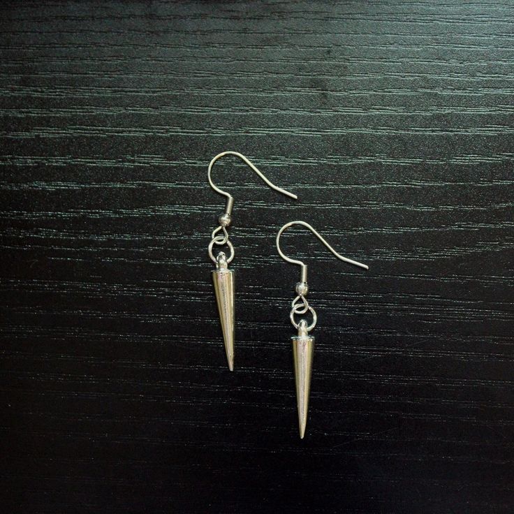 ̩̩͙✩ Handmade earrings with silver spikes ✩*̩̩͙*˚ Overview: ⋆ 1 inch aluminum alloy spike charms ⋆ Stainless steel earring hooks & hardware ⋆ Lightweight ⋆ Handmade Please send a message on Etsy or email ForestAnatomy@gmail.com if you have any questions. Thanks for visiting! More items here → https://www.etsy.com/shop/ForestAnatomy Nickel-free Punk Earrings, Hypoallergenic Punk Dangle Earrings, Hypoallergenic Dangle Earrings In Punk Style, Nickel-free Metal Earrings In Alternative Style, Alternative Style Nickel-free Metal Earrings, Nickel-free Metal Alternative Style Earrings, Edgy Nickel-free Dangle Plug Earrings, Nickel Free Edgy Plug Earrings As Gift, Edgy Nickel-free Plug Earrings As Gift