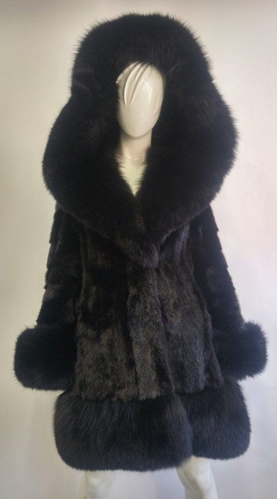 BEAUTIFUL & VERY STYLISH BLACK MINK FUR COAT FOR WOMEN MADE FROM FULLY LET OUT SKINS! THE HOOD IS FIXED AND COMPLETED WITH BRAND NEW BLACK FOX FUR TRIM. ALSO FOX FURS AT CUFFS, BOTTOM OF THE COAT AND INSIDE THE HOOD. IT CLOSES WITH FRONT HOOK & EYE CLOSURES AND HAS TWO SIDE POCKETS. THIS COAT IS REFURBISHED NEW, MADE TO MEASUREMENT. AFTER BUYING THIS ITEM, IT WOULD BE VERY MUCH APPRECIATED IF YOU COULD PROVIDE YOUR HEIGHT, WEIGHT AND BUST CIRCUMFERENCE, SO WE CAN MAKE THE COAT TO YOUR SIZE.  MEA Fox Fur Jacket, Black Fox, Mink Fur Coat, Coat For Women, Fox Fur Coat, Swaggy Outfits, Mink Fur, 여자 패션, Hook Eye