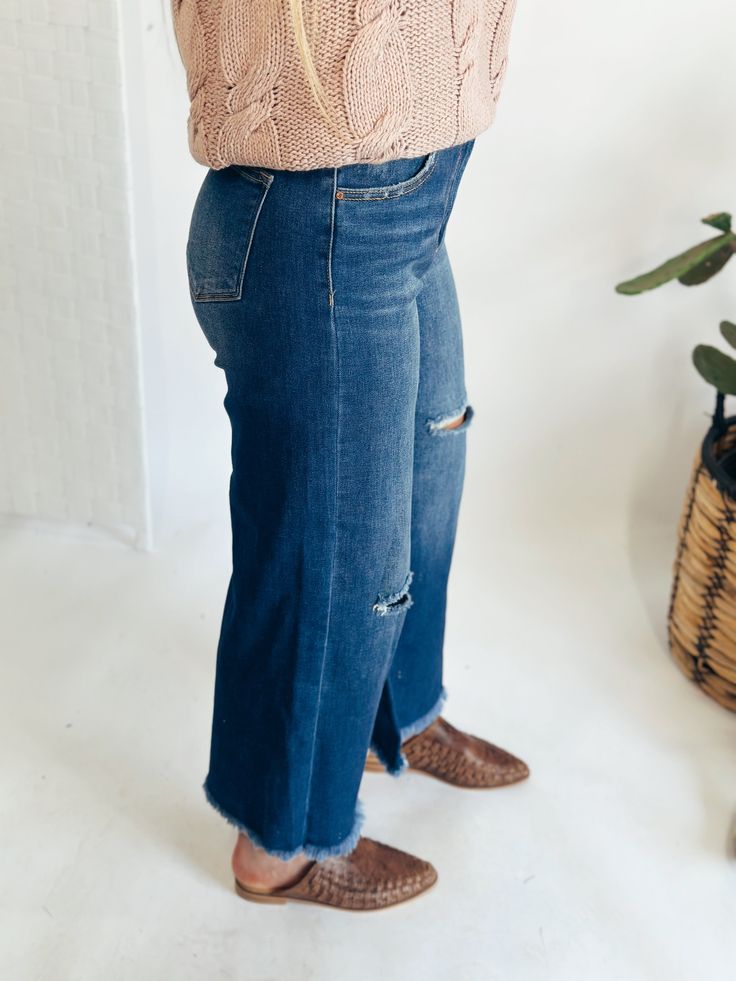 These Risen jeans are to die for! They have the perfect amount of distressing and will be a staple in your closet. These can be HIGH RISE FRAYED ANKLE WIDE JEANS - Rise: 11" | Inseam: 25.5" Fabric Contents65% COTTON, 32% POLYESTER, 1.5% VISCOSE, 1.5% SPANDEX Straight Leg Distressed Flare Jeans In Medium Wash, High Rise Denim Jeans With Frayed Hem, Dark Wash Straight Leg Jeans With Frayed Hem, Denim Flare Jeans With Frayed Hem For Fall, Fall Mid-rise Jeans With Frayed Hem, High Rise Distressed Cropped Jeans In Denim Blue, Dark Wash Denim Flare Jeans With Frayed Hem, Fall Cropped Distressed Dark Wash Jeans, Fall Cropped Denim Blue Jeans With Frayed Hem