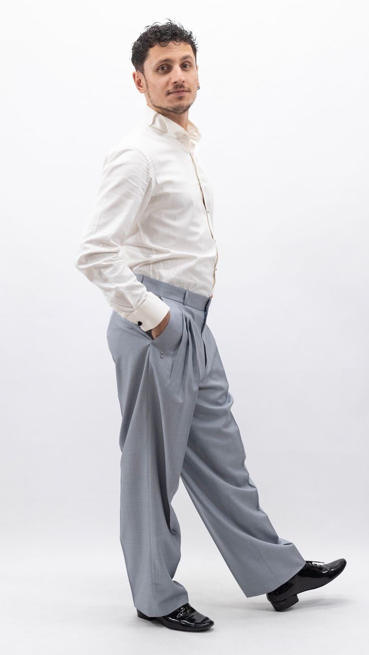 "These tango pants feature a standard waistline, sitting at or slightly below the natural waist. They offer a more conventional fit compared to high-waist designs. Fabric Choices: Similar to high-waist tango pants, they're crafted from quality materials such as cotton, polyester, and lycra providing flexibility and comfort for dance movements. Details: These pants may have 3 pleats and has a discreet embellishment, letter 'C',  near the pockets,which is associated with \"Chique\" could represent the brand's monogram. It is elegantly incorporated into the design, showcasing the brand's identity and reinforcing its presence in the fashion market.adding a touch of style without being too flashy. Color and Style: Available in various colors, they range from classic black, navy, and gray to mor Semi-formal Slim Fit Full-length Bottoms, Casual Bottoms With Welt Pockets For Tailoring, Slim Fit Full Length Bottoms For Semi-formal Occasions, Casual Tapered Leg Pants For Tailoring, Fitted Trousers Without Pockets, Casual Fitted Pants For Tailoring, Modern Relaxed Fit Bottoms For Formal Occasions, Classic Fitted Bottoms With Hip Pockets, Fitted Trousers With Hip Pockets