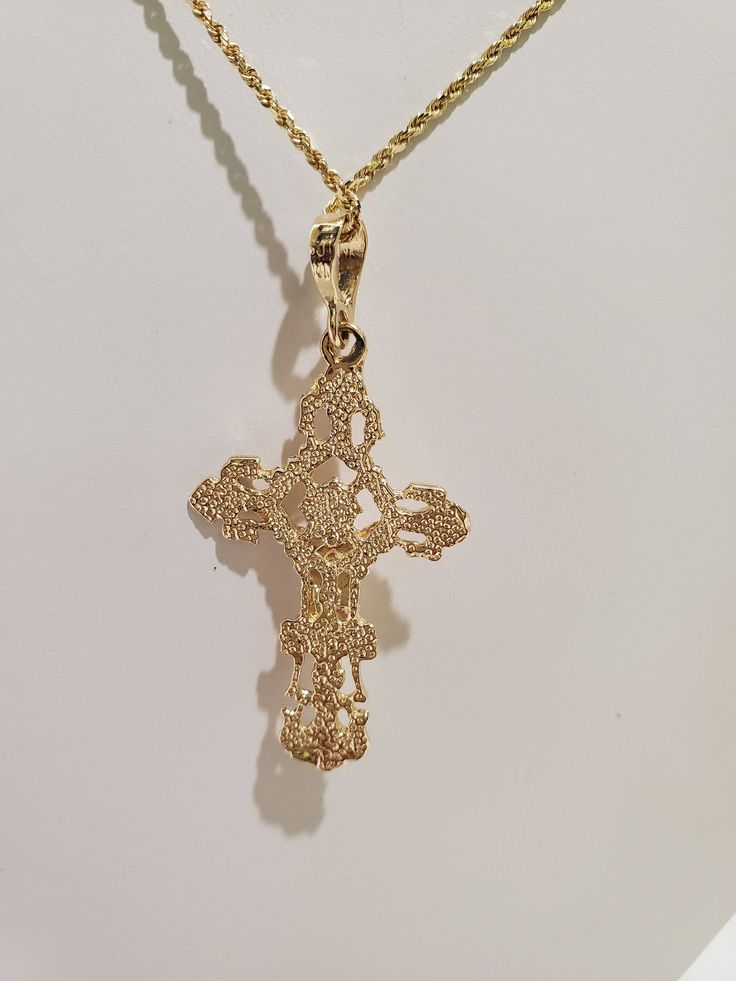 "You are viewing a beautiful 24k.solid gold Jesus cross pendant. The pendant total weight approx. 3.64 grams. NOTE : CHAIN NOT INCLUDED The pendant measures approx.1 3/4 inches tall x 7 /8 inches wide.. The cross marked 14k at the back. The cross pendant is nicely carved with Jesus on the cross , diamond cut style so its spark in any angle as you wear it. Please take a closer at the video and photos. When listing and describing our items we make a conscious effort to over describe all imperfecti Yellow Gold Plated Cross Pendant Necklace, Gold Filigree Crucifix Jewelry, Gold Plated Yellow Gold Crucifix Necklace, Yellow Gold Plated Crucifix Cross Necklace, Gold-plated Yellow Gold Crucifix Necklace, Gold Plated Spiritual Cross Jewelry And Charms, Yellow Gold Crucifix Cross Necklace, Gold Plated, Gold Hallmarked Crucifix Charm, Hallmarked Yellow Gold Cross Pendant