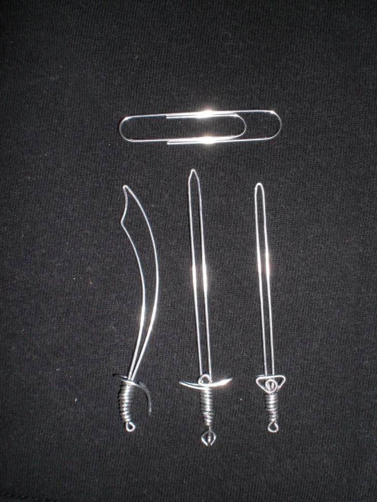 three different types of knifes and tongs on a black surface