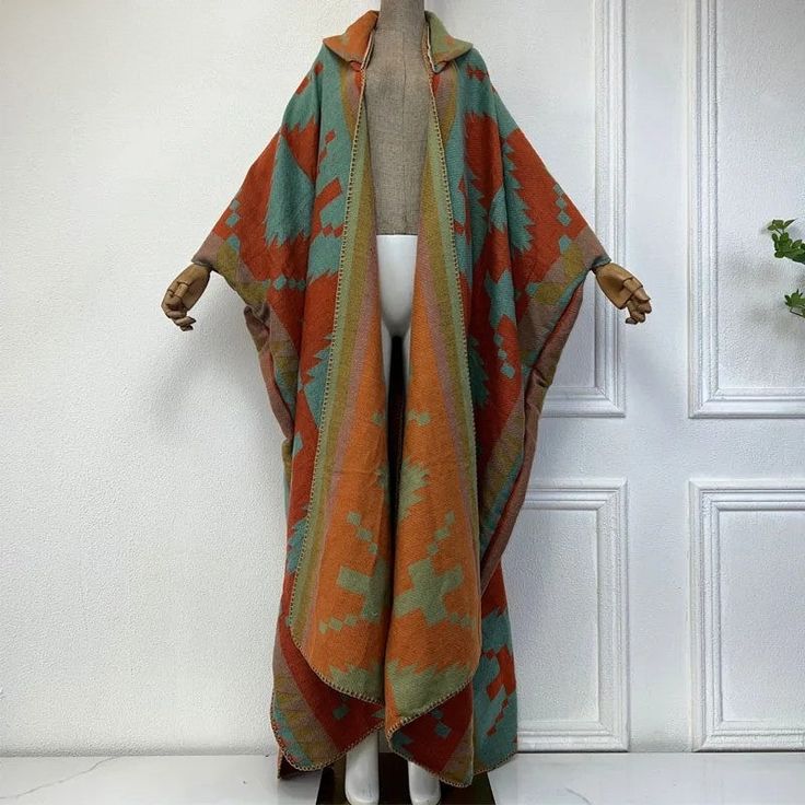 This super soft and warm wool cardigan kimono is perfect for the cold weather. Unlike other sweaters and wools, the wool used for this beauty is non itchy. Think of your favorite throw blanket, the comfort and warmth it gives but 10x stylish and wearable any where. This kimono is all that and more! One size fits S-4X Material: Wool One Size Fits Most Size Chart Bohemian Shawl For Fall Layering, Wool Outerwear For Winter Loungewear, Wool Outerwear For Winter, Winter Cozy Cardigan With Shawl Collar, One Size Long Sweater For Fall, Winter Cozy Shawl Collar Cardigan, Cozy Long Cardigan For Cold Weather, Oversized Long Acrylic Outerwear, Fall Loungewear Sweater Coat With Shawl Collar