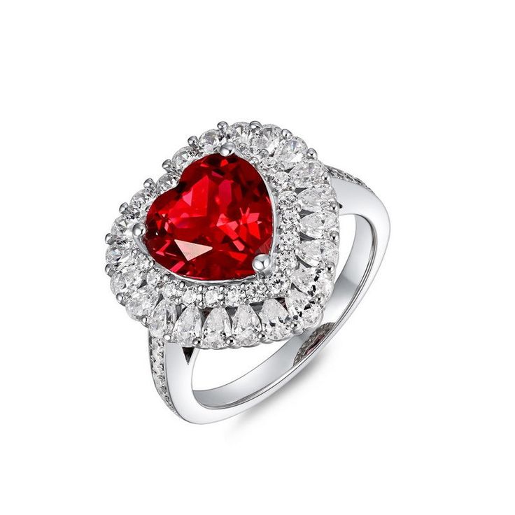 a red heart shaped ring with white diamonds on the sides and a center stone in the middle