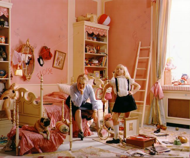 two girls are playing in the bedroom with their doll house furniture and toys on the floor