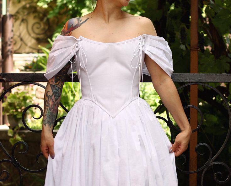 Corset top, corset dress, renaissance corset, stays, puff sleeve dress. Handmade linen corset for renaissance fair. White corset top for wedding. You can buy this skirt in my shop: https://www.etsy.com/shop/Clan21 You can also change the corset model and skirt length, just contact us. SIZE XS - Bust 32-34", Underbust 27-29", Waist 24-26", Hips 34-36" S - Bust 34-36". Underbust 29-31", Waist 26-28" Hips 38'-40" M - Bust 36-38", Underbust 31-33", Waist 28-30", Hips 38-40" L - Bust 38-40", Underbust 33-35", Waist 30-32", Hips 40-42" XL - Bust 40-42", Underbust 35-37", Waist 32-34", Hips 42-44" XXL - Bust 42-44", Underbust 37-39", Waist 34-36", Hips 44-46" Corset waist measurements by size, measured edge-to-edge: XS - 22" / S - 24" / M - 26" /L - 28" / XL - 30" / XXL - 32" DETAILS - Contains: Fitted Corset Dress With Ruched Bodice, Fitted Corset Dress With Gathered Sleeves, Fitted Overbust Corset With Ruched Bodice, Underbust Corset With Ruched Bodice, White Square Neck Corset With Fitted Bodice, Fitted Underbust Corset With Ruched Bodice, Sweetheart Neckline Corset Dress For Costume Party, White Square Neck Fitted Corset, Fitted Medieval Corset Dress With Boned Bodice