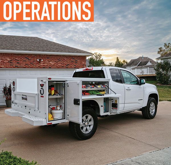 a white truck parked in front of a house with the words operation written on it