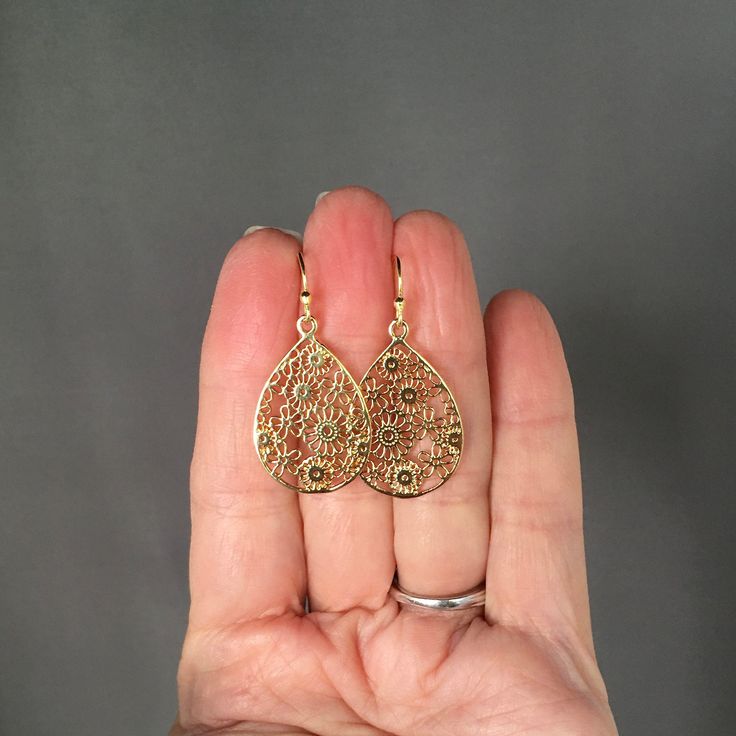 "Beautifully detailed 14k bright gold vermeil filigree teardrop flower charms simply dangle from 18k gold vermeil balled earwires. These lightweight go-with-everything earrings complete any outfit for daytime or evening. Gold flower charms: 19x29mm Total length of earrings: 1 1/2\" All gold is vermeil. A matching necklace is available... www.etsy.com/listing/942764148/gold-flower-pendant-necklace As the owner, maker, designer, and curator of this shop, I take great pride in providing you with je Teardrop-shaped Gold Plated Filigree Jewelry, Gold Plated Filigree Teardrop Jewelry, Gold Filigree Teardrop Pendant Jewelry, Gold Teardrop Pendant Earrings For Gift, Gold Teardrop Pendant Jewelry With Matching Earrings, Gold Pear-shaped Teardrop Earrings As Gift, Gold Pear-shaped Teardrop Earrings For Gift, Gold Hypoallergenic Pear-shaped Teardrop Earrings, Gold Pear-shaped Hypoallergenic Teardrop Earrings