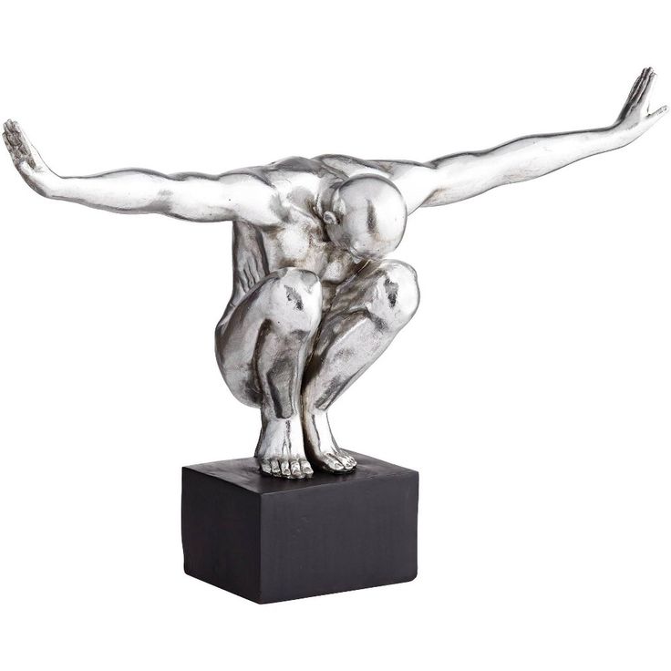 a silver statue of two people holding each other