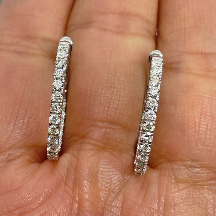 Stunning Diamond Hoop Earrings White Gold.  There's diamonds set on the outside and Inside of the hoop.  Simple and Stylish earrings to wear on any occasion.  Excellent craftsmanship, the diamonds are very sparkling.  The lock on these earrings are very secure and easy to take on and off.    The oval shape looks flattering on.  Nice size hoops, not too big or small.  Measures about 23 x 16.5mm.  About 2mm width.  Special price one pair only.   Genuine Round Brilliant Cut Diamonds  Total Weight: 1.18 carats All white and shiny Diamonds, no cloudy  Clarity: SI/I Color: G/H Solid 18K White Gold  Comes with gift box * We have been in the wholesale Jewelry business for over 30 years serving the community at the same location.  All diamonds we use are natural stones and fine quality gold.  Absol Luxury Oval Diamond White Hoop Earrings, Oval Hoop Earrings In Diamond White With Brilliant Cut, Diamond White Oval Hoop Earrings For Formal Occasions, Diamond White Oval Hoop Earrings With Prong Setting, Oval Diamond White Hoop Earrings Fine Jewelry, Oval Hoop Earrings With Brilliant Cut For Formal Occasions, Oval Brilliant Cut Hoop Earrings For Formal Events, Oval Diamond Hoop Earrings In White Gold, Oval Diamond Hoop Earrings With Diamond Accents