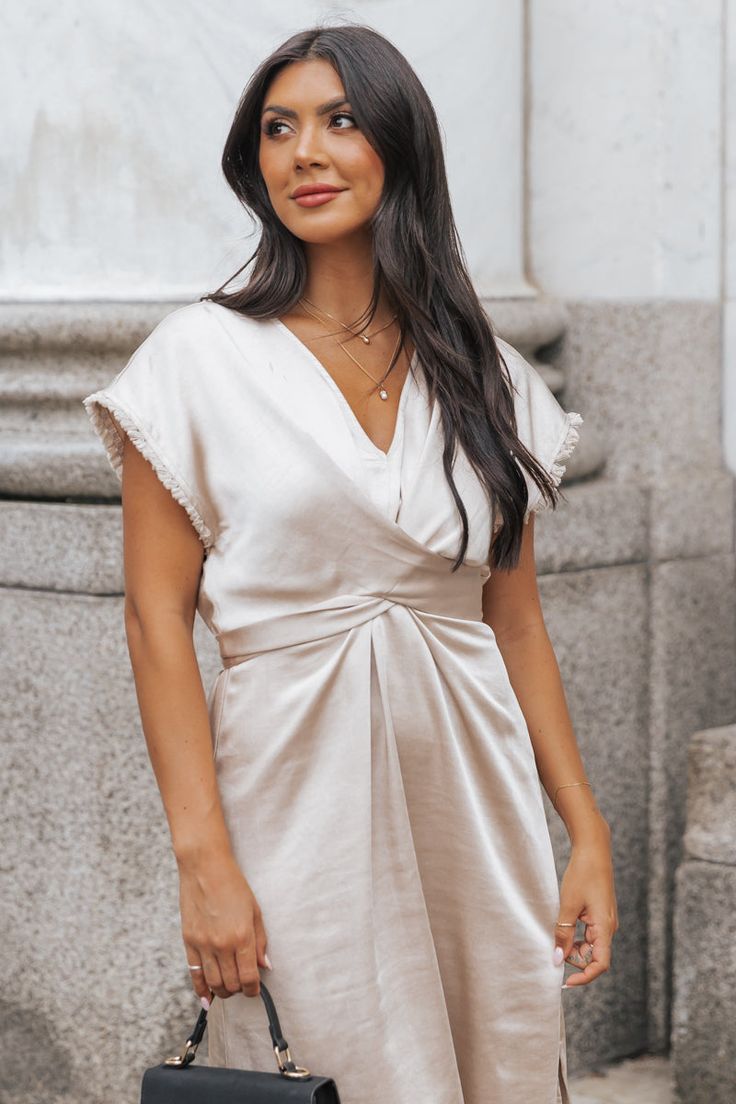 Elevate your wardrobe with this versatile and luxurious dress. Perfect for any occasion! This Champagne Satin Wrap Midi Dress boasts a sophisticated v neckline and elegant fringe detail. Made from 100% polyester, it offers both style and comfort in one stunning piece. Pair it with strappy high heels, elevated gold jewelry, and a neutral crossbody bag for a chic evening outfit! Luxurious Dress, Luxurious Dresses, Evening Outfit, Strappy High Heels, Wrap Midi Dress, Evening Outfits, Date Night, Final Sale, Bootie Boots