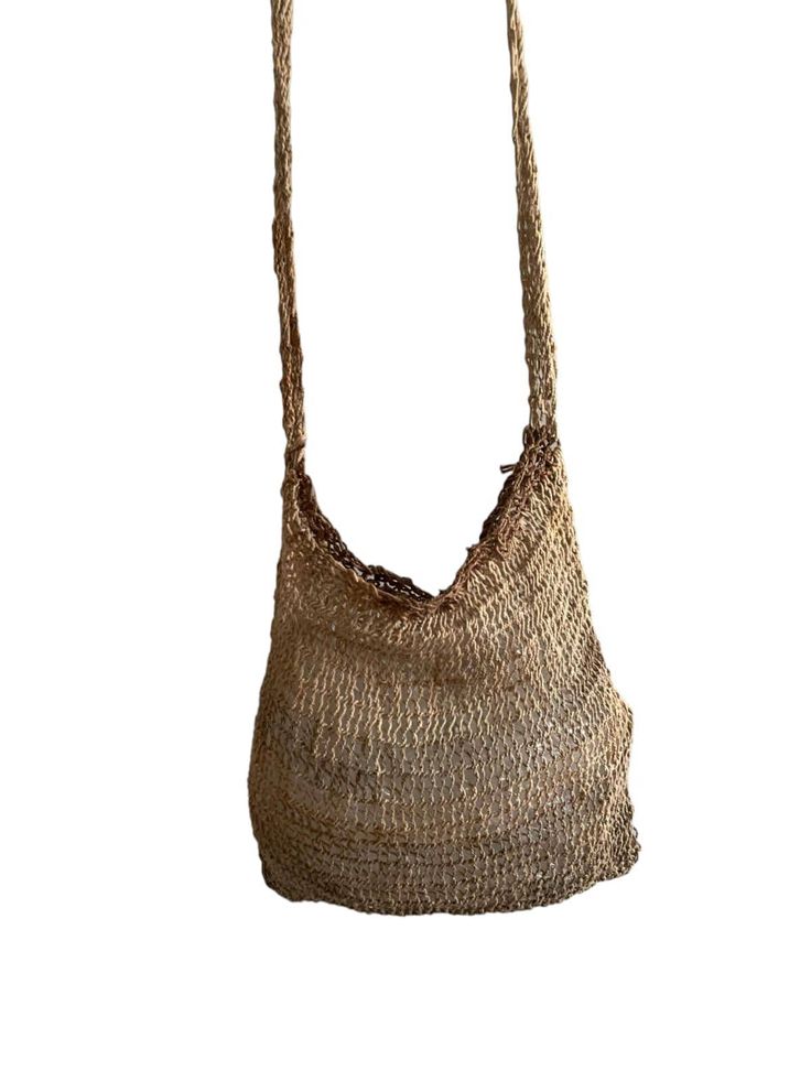 Experience the unique beauty and practicality of the Noken bag, a traditional handwoven bag from Papua, Indonesia. Made from natural fibers, each bag is a testament to the rich cultural heritage of the Papuan people. Eco-friendly Handwoven Natural Crochet Bag, Natural Open Weave Shoulder Bag, Daily Use Woven Shoulder Bag In Natural Fiber, Daily Use Shoulder Bag In Woven Natural Fiber, Daily Use Shoulder Bag With Woven Natural Fiber, Natural Fiber Bucket Shoulder Bag With Open Weave, Natural Open Weave Bucket Bag For Everyday Use, Natural Fiber Open Weave Bucket Shoulder Bag, Natural Fiber Shoulder Bag For Daily Use