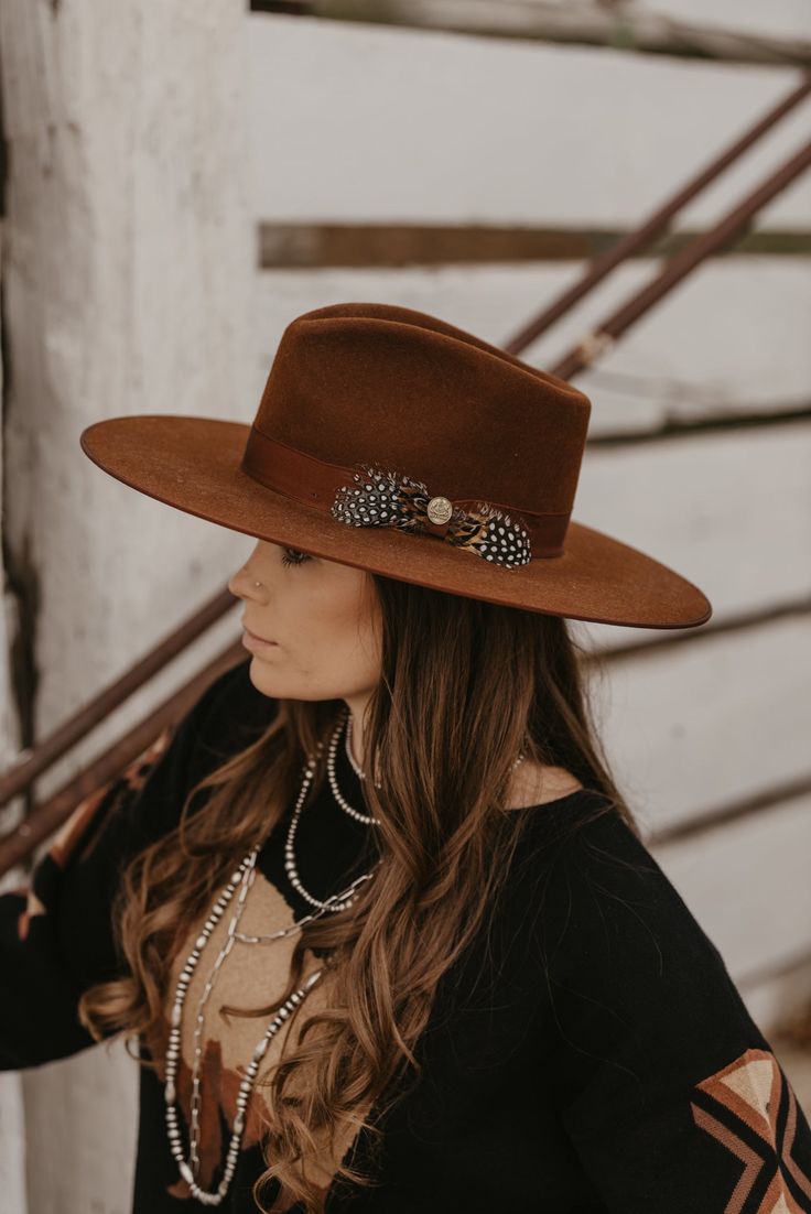 With a wide, flat brim, the Midtown Wide Flat Brim Hat is a rakish hat that, true to its name, exudes city style. Made in Texas from firm high-quality felt, it features a grosgrain ribbon hat band accented by a bold feather accent. On the interior, an absorbent Dri-Lex sweatband ensures it’s as comfortable as it is stylish. Made by Stetson Handmade in Garland, Texas Quality Wool Felt Center Pinch Front Crown Grosgrain Hatband Dri-Lex Sweatband Satin Liner Brim: 3 3/4” Crown: 4 1/2” Womens Felt Cowboy Hat, Fall Flat Brim Top Hat, Fall Fur Felt Boater Hat With Flat Brim, Western Brown Boater Hat With Flat Crown, Brown Flat Brim Boater Hat For Fall, Fall Fur Felt Boater Hat With Flat Crown, Classic Brown Boater Hat For Fall, Brown Flat Brim Boater Hat For Rodeo, Brown Flat Crown Boater Hat For Winter