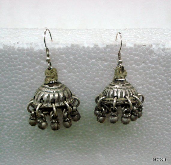 Vintage Antique collectible tribal old silver earring pair (Tokariya) from Rajasthan India. Worn by tribal womens of Rajasthan. Beautiful design adorn with silver bells. very good worn pair great for jewellery collection. Length with wire - 4.7 cm(1.85") Weight of pair - 23.5 gramsMaterial - silver & original old worn pair. Silver Tilla Jhumkas For Festival, Traditional Silver Tilla Earrings, Bohemian Sterling Silver Heavy Jhumkas, Traditional Silver Earrings With Tilla, Bohemian Silver Handmade Jhumkas, Handmade Silver Bohemian Jhumkas, Bohemian Silver Tilla Jhumkas, Bohemian Sterling Silver Jhumkas For Festivals, Silver Bohemian Jhumkas For Festivals