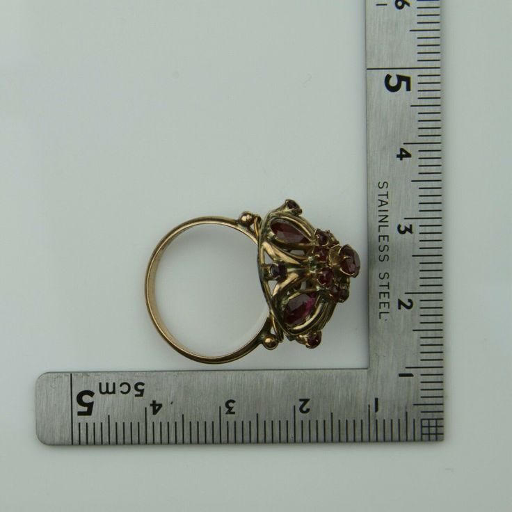 Antique 14K Yellow Gold Ruby Dome Ring, almost rose color gold, .5 inch high, .75 inch across, 4 pear shaped rubies, 12 round rubies, not calibre cut, 3.82 grams, Circa 1940, Size 7. SKU # BB264R25 Most rings are sizable for a small fee. If the ring you are considering is the incorrect size contact us for a quote. This listing contains photographs of the actual item you will receive. Our items are in excellent condition with little or no signs of wear and many are one of a kind pre-owned estate Antique 14k Gold Ruby Ring With Multi-stone, Gold Multi-stone Pear-shaped Ring, Gold Ruby Ring Pear-shaped, Pear-shaped 14k Gold Ruby Ring, Pear-shaped Ruby Ring In Gold, Pear-shaped Yellow Gold Ruby Ring, Antique Multi-stone Ruby Ring In Gold, Antique Multi-stone Gold Ruby Ring, Antique Yellow Gold Multi-stone Ruby Ring