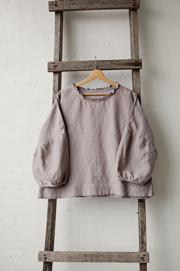 Tunic is made from 100% soft and washed linen. Match it with our skirts! Details: - Composition: 100% Oeko-Tex certified linen - Colour: lavender - Ruffle neckline - Dropped shoulders - Size: One size/fits all - Medium weight linen - Linen care: machine wash gentle; tumble dry low, ironing optional - The price is for one tunic, other pictured items are not included Measurements: Length from shoulder down: 55 cm (21,66 in) Chest width: 140 cm (55,1 in) Sleeve length (from collar): 60 cm (23,6 in) Linen Lagenlook Tunic Top, Linen Tunic Top In Lagenlook Style, Lagenlook Linen Tunic Top, Relaxed Fit Ramie Tops For Daywear, Oversized Bohemian Linen Tops, Oversized Linen Lagenlook Tops, Relaxed Fit Ramie Blouse For Daywear, Oversized Long Sleeve Ramie Tops, Linen Lagenlook Tops For Daywear