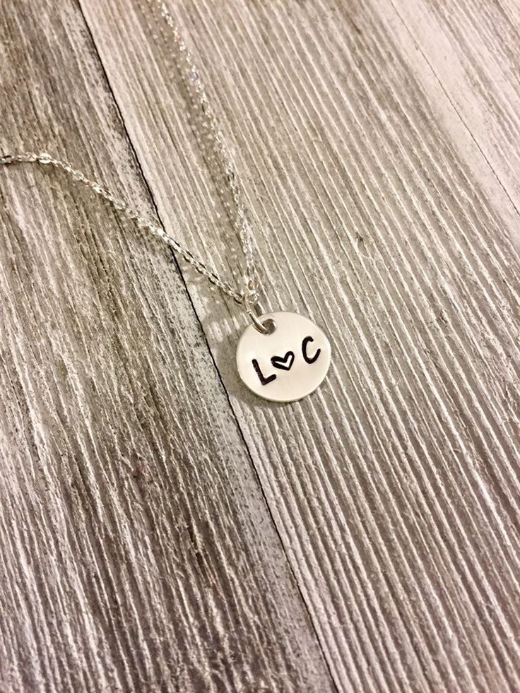 "A feminine, delicate personalized sterling silver necklace perfect for your girlfriend, wife, fiancée... whoever is that special person in your life! Simple, small (about size of a dime) pendant - perfect piece of jewelry to wear everyday! I hand stamp this necklace with whatever initials you would like. It is made just for you and will become a special keepsake. This necklace comes with a beautiful 18 inch sterling silver chain Your jewelry will arrive in a gift box with a bow. I really hope y Minimalist Personalized Charm Necklace For Anniversary, Minimalist Personalized Charm Necklaces For Anniversary, Simple Hand Stamped Necklace As Gift, Dainty Hand Stamped Charm Necklace For Anniversary, Dainty Hand Stamped Necklaces For Anniversary, Dainty Hand-stamped Charm Necklace For Anniversary, Anniversary Dainty Hand-stamped Charm Necklace, Simple Pendant Charm Necklace For Anniversary, Simple Initials Jewelry For Wedding