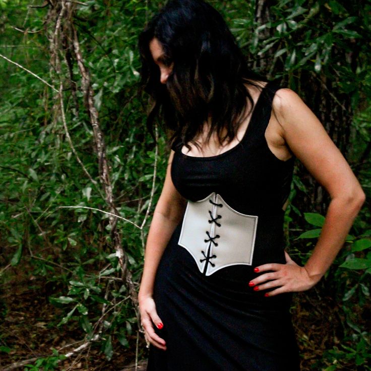 These corsets are the perfect costume accessory for any Renaissance, Medieval, Fairy, Elvish, and many more cosplay outfits.  These corsets are great quality with embroidered edges, metal eyelets, and leather ties.  They have a very comfortable fit made from vinyl leather and the elastic straps will contour to your body and snap in the back.   FAUX LEATHER COLOR OPTIONS: 14 Colors available ELASTIC COLOR: Elastic will be BLACK for all corset belts. SIZE OPTIONS: Recommended for Kids & Youth X-Small: 23" - 27" length Small: 26" - 32" length Recommended for Adult  Medium: 32" - 36" length Large: 36" - 42" length X-Large: 40" - 46" length Gothic Black Corset For Larp, Black Gothic Corset For Larp, Black Steampunk Corset For Larp, Punk Style Corset For Fantasy Events, Punk Corset For Cosplay And Halloween, Black Fitted Medieval Corset Belt, Black Medieval Underbust Corset Belt, Steampunk Corset Belt For Fantasy Events, Fitted Medieval Corset Belt For Halloween