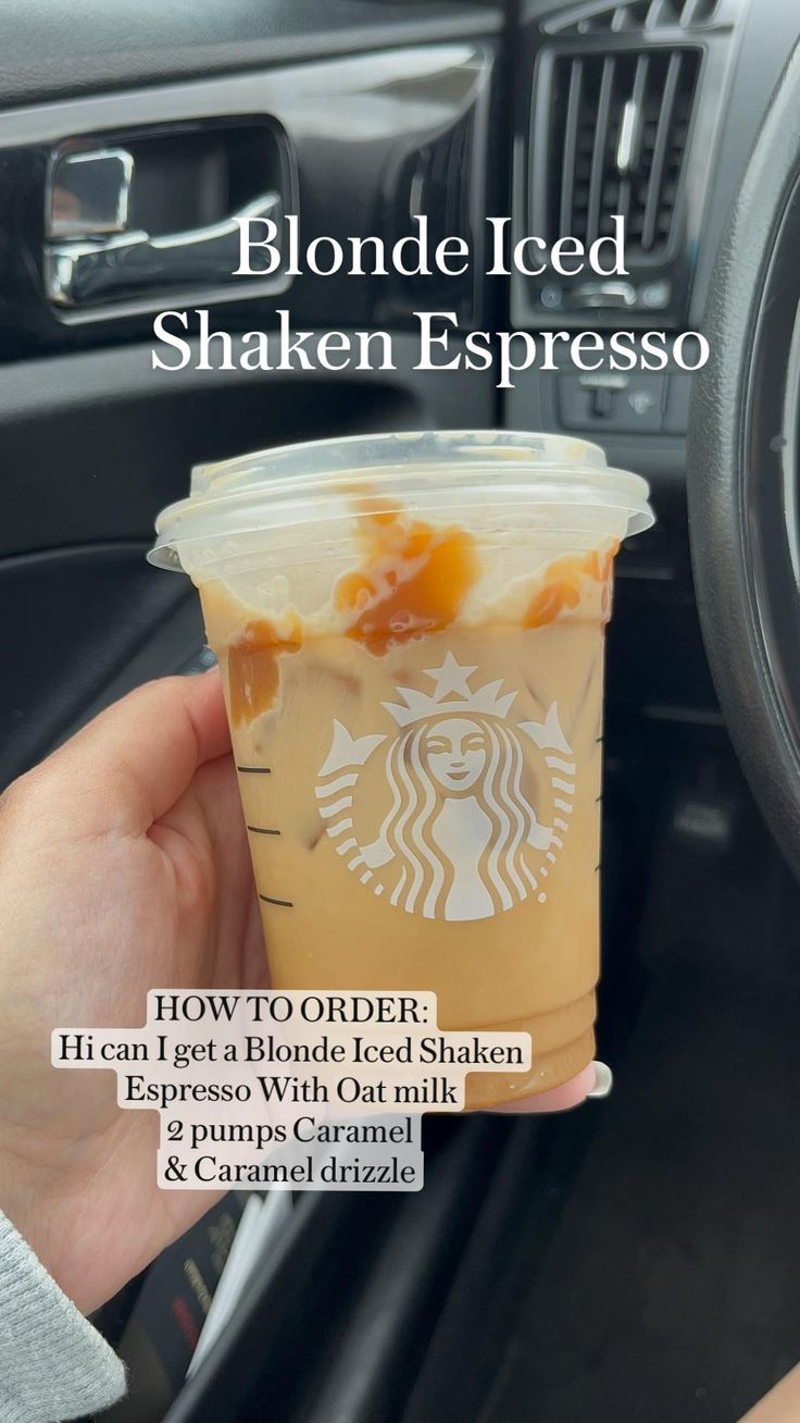 someone is holding up a cup of iced coffee in their hand with the words, blonde iced shaken espresso