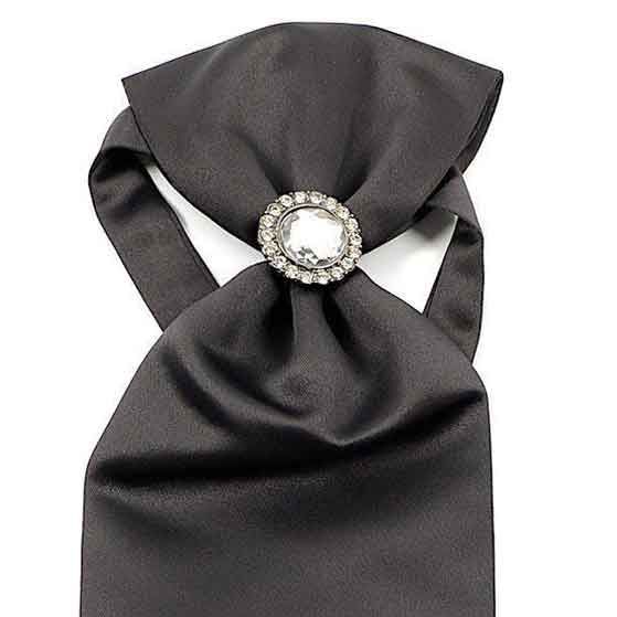 Elevate your formal attire with our Ascot Tie with Jewel Ring. This exquisite accessory combines the timeless elegance of a classic ascot tie with a touch of contemporary flair, thanks to the addition of a decorative jewel ring. Made from luxurious fabric, this ascot offers a sophisticated, rich texture and an impeccable drape. The jewel ring serves as both a stylish focal point and a practical solution to keep the ascot neatly in place. Perfect for weddings, formal events, or any occasion where Elegant Jewelry Brooch, Elegant Formal Jewelry With Brooch, Elegant Wedding Brooch Jewelry, Classic Jewelry With Ties For Parties, Elegant Adjustable Jewelry For Evening, Elegant Adjustable Silver Suit And Tie Accessories, Silver Elegant Suit And Tie Accessories For Gift, Elegant Silver Suit And Tie Accessories For Gift, Elegant Black Jewelry For Formal Occasions