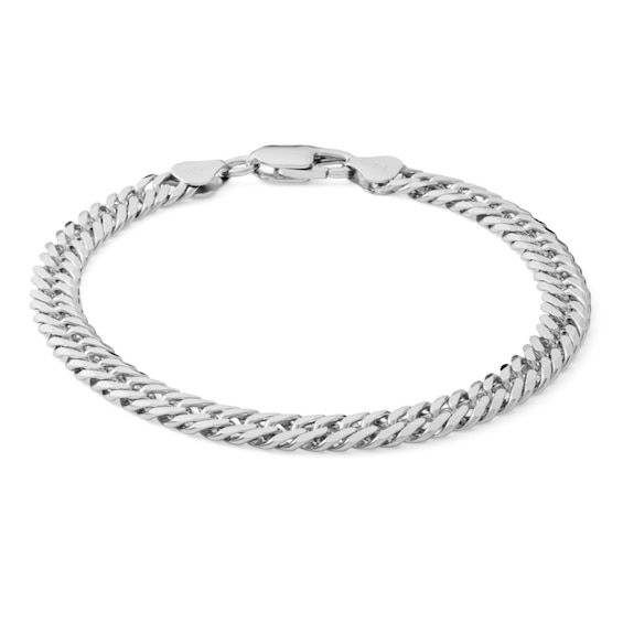 From the Made in Italy Collection, this 120 gauge Cuban curb chain bracelet set in sterling silver measures 8.5 inches in length and secures with a lobster claw clasp. Classic Silver Cuban Link Bracelet, Classic Cuban Link Silver Bracelet, Classic Silver Cuban Link Bracelet With Oval Links, Classic Sterling Silver Cuban Link Bracelet With Silver Chain, Modern Sterling Silver Curb Chain Bracelet, Classic Sterling Silver Cuban Link Bracelet, White Gold Link Charm Bracelet With Jubilee Design, Silver Cuban Link Jubilee Bracelet For Everyday, Classic Cuban Link Silver Chain Bracelet