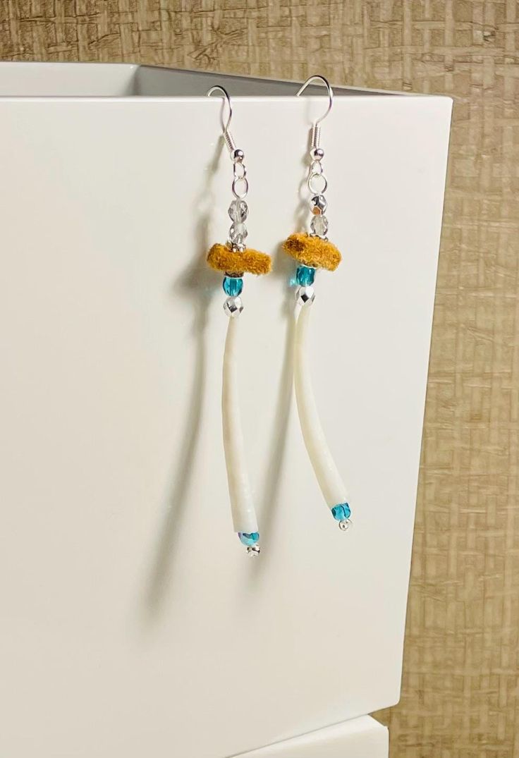 Teal and silver crystals with dentalium shells and traditionally tanned mooseskin. It is about 3 inches in length. Dentalium Earrings, Crystal Beads, Bead Work, Jewelry Earrings Dangle, Dangle Drop Earrings, Dangle Earrings, Jewelry Earrings, Drop Earrings, Beads