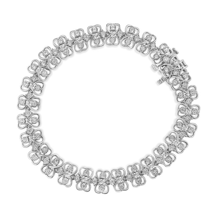 This lovely sterling silver link bracelet will make you stand out with 1 ct TDW of diamonds. Two heart cut outs sit opposite each other and create a ribbon like link that hold within two miracle set, round cut diamonds. Additional sparkling round cut diamonds connect the ribbon like links to each other and give life to this stunning bracelet that secures with a box with clasp mechanism. Luxury Heart Cut Jubilee Bracelet, Luxury Heart-shaped Tennis Bracelet For Anniversary, Luxury Heart Cut Tennis Bracelet In Fine Jewelry, Luxury Heart Cut Tennis Bracelet For Wedding, Luxury Heart-shaped Tennis Bracelet For Formal Occasions, Luxury Diamond Tennis Bracelet With Heart Cut, Bracelet Tennis, Silver Link Bracelet, Heart Cut Out