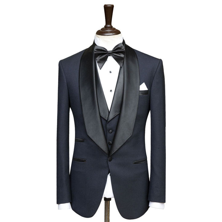 Package Includes: 1 x Jacket - 1 x Waistcoat - 1 x Pant

The Custom Deep Blue Tuxedo with Shawl Lapel is a masterpiece that seamlessly blends timeless elegance with a touch of luxurious sophistication. Meticulously handcrafted by our skilled artisans, this tuxedo is a testament to our unwavering commitment to impeccable craftsmanship. The deep blue hue exudes an air of refinement and versatility, making it a perfect choice for a range of formal occasions. The highlight of this tuxedo is the exqu Elegant Notch Lapel Tuxedo For Fall, Elegant Fall Tuxedo With Notch Lapel, Elegant Fall Tuxedo With Hidden Button Closure, Elegant Winter Tuxedo With Lapel Collar, Elegant Tailored Fall Tuxedo, Luxury Winter Suits With Shawl Collar, Elegant Custom Fit Outerwear For Fall, Elegant Winter Three-piece Suit For Work, Elegant Three-piece Winter Suit For Work