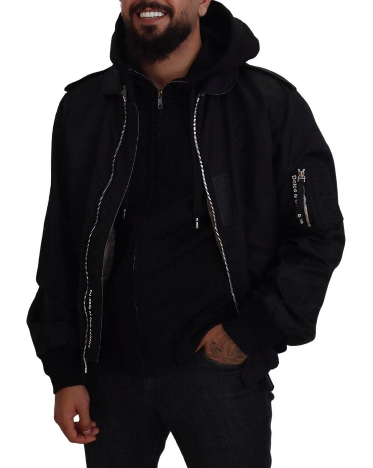 DOLCE & GABBANA Absolutely stunning, 100% Authentic, brand new with tags Dolce & Gabbana nylon bomber jacket. Full-zip closure and hood. Model: Hooded jacket Colour: Black Full zipper closure Two outside pockets and two inside pockets Logo details Made in Italy Material: 90% Nylon 10% Cotton Streetwear Nylon Parka With Zipper Closure, Streetwear Nylon Outerwear With Double-lined Hood, Nylon Hooded Jacket With Zipper For Streetwear, Nylon Outerwear With Double-lined Hood For Streetwear, Hooded Outerwear With Zip Fly For Streetwear, Urban Parka With Zipper Closure For Streetwear, Winter Streetwear Parka With Ykk Zipper, Urban Nylon Hooded Jacket With Zipper Closure, Urban Hooded Outerwear With Ykk Zipper