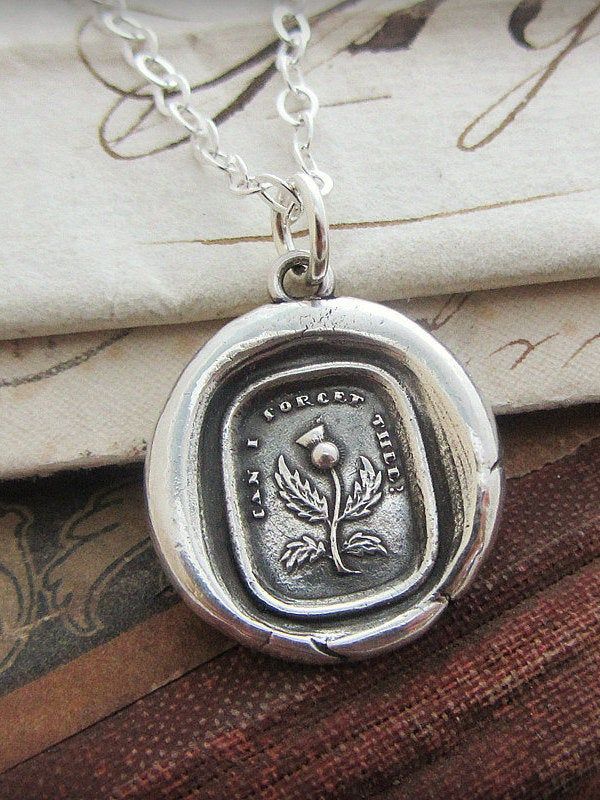 "A detailed Thistle with the caption reading \"How Can I forget Thee\"? A token of remembrance and symbolic of friendship. Perfect for gifting to a friend, a favorite teacher or co-worker, this charm is a reminder that you'll never forget the meaning they've had in your life and the memories you'll cherish forever! The Thistle symbolizes strength, unity and friendship. D E T A I L S: * 925 Sterling Silver * Wax Seal Pendant is 3/4\" * Select from several 925 sterling silver chain styles or choos Symbolic Stamped Necklace For Gift, Symbolic Stamped Necklace For A Gift, Vintage Necklace With Engraving Option As Gift, Personalized Symbolic Necklaces For Commemoration, Personalized Symbolic Necklace For Commemoration, Vintage Hand Stamped Jewelry Gift, Personalized Vintage Necklace For Memorial, Classic Stamped Necklace As A Gift, Vintage Hand-stamped Round Pendant Jewelry