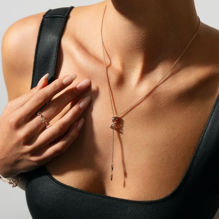 This Iconic X Lariat Necklace invites you to uncover your inner treasures through its bold and iconic design, making a definitive statement of discovery and self-expression. Accent diamonds: 0.05+ ctw, VS2+/F+ Setting: Prongs setting Pendant dimensions: 72 x 6 mm approx. Chain Type: Ovale Trace Closure: Lobster clasp Elegant Tarnish Resistant Lariat Jewelry, Elegant Tarnish-resistant Lariat Jewelry, Elegant Lariat Necklace, Tarnish Resistant, Luxury Lariat Necklace With Detachable Pendant, Elegant Tarnish Resistant Lariat Necklace, Fine Jewelry Lariat Necklace With Adjustable Chain, Elegant Tarnish Resistant Lariat Necklaces, Modern White Gold Lariat Necklace, Luxury Rose Gold Lariat Necklace Gift