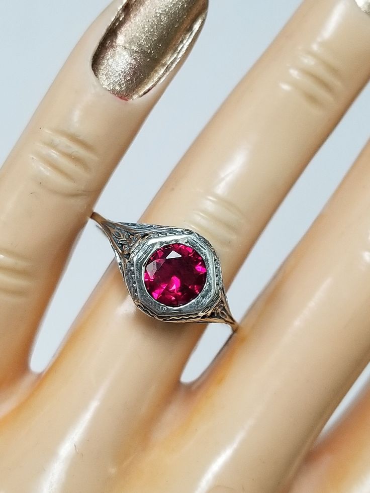 "Thanks for shopping our vintage estate store. We tend to sell well below wholesale and truly hope you enjoy all of our items. Many of the items are one of a kind, so please enjoy scrolling through the pictures and hopefully something will catch your eye. Brown spots are from the camera or reflections. Estate sterling silver 925 created 1ct ruby filigree ring. This is a custom made item from our shop, meaning we set the gem into the vintage setting. Gem is testing natural, but more than likely c Vintage Gemstone Rings For Anniversary, Pink Rings With Intricate Design For Anniversary, Vintage Sterling Silver Filigree Ring, Antique Ruby Ring With Filigree For Anniversary, Vintage Ruby Ring With Diamond Cut, Antique Diamond Cut Ruby Ring For Anniversary, Vintage White Gold Birthstone Ring, Antique Ruby Ring With Diamond Cut For Anniversary, Vintage Hallmarked White Gold Ruby Ring