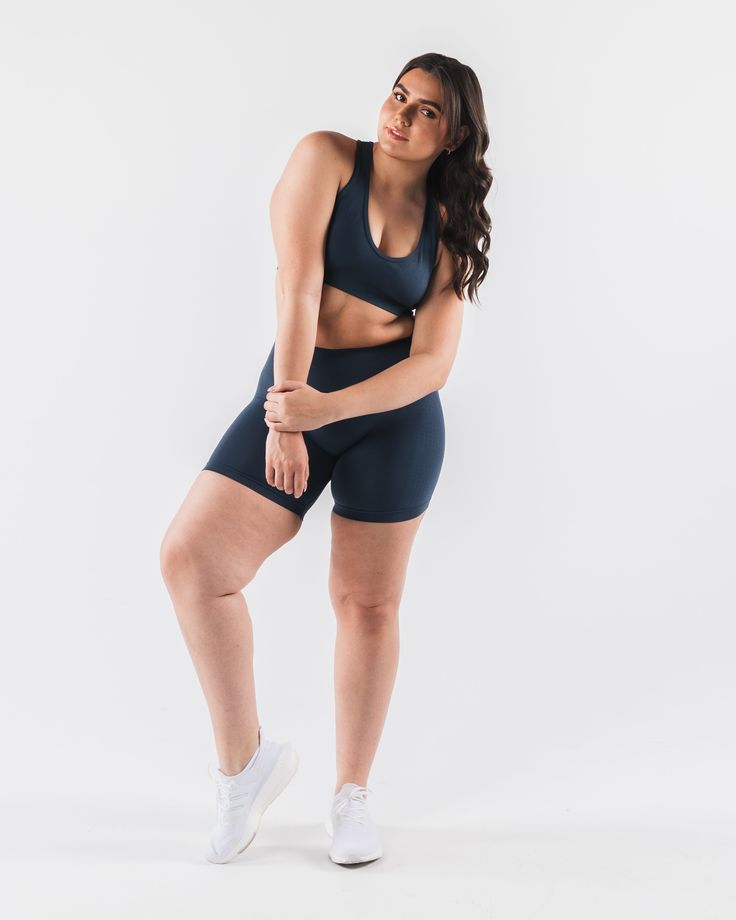 HIGHLIGHTS. Seamless construction Rib panel to contour and support Low to Medium impact Moisture-wicking breathable fabric Flattering scoop neckline A/B/C cup size FIT SUGGESTION. This item runs true to Alphalete's standard seamless fit.. We recommend sizing up for a comfortable fit.. Brooke is 5’5”/165cm, wearing a size S with a 35”/88.9cm bust. Hannah is 5'11/180.3cm, wearing a size L with a 42.5"/108cm bust. MATERIALS AND WASHING DIRECTIONS. 51% Polyamide, 38% Polyester, 11% Elastane. We reco Blue Racerback Sports Bra With Medium Bust Support, Blue Compressive Racerback Activewear, Blue Scoop Neck Sports Bra For Athleisure, Blue Sports Bra With Seamless Construction For Workout, Blue Athleisure Sports Bra With Scoop Neck, Athleisure Blue Scoop Neck Sports Bra, Blue Scoop Neck Sports Bra, Blue Medium Support Sports Bra With Scoop Neck, Blue Scoop Neck Sports Bra For Gym