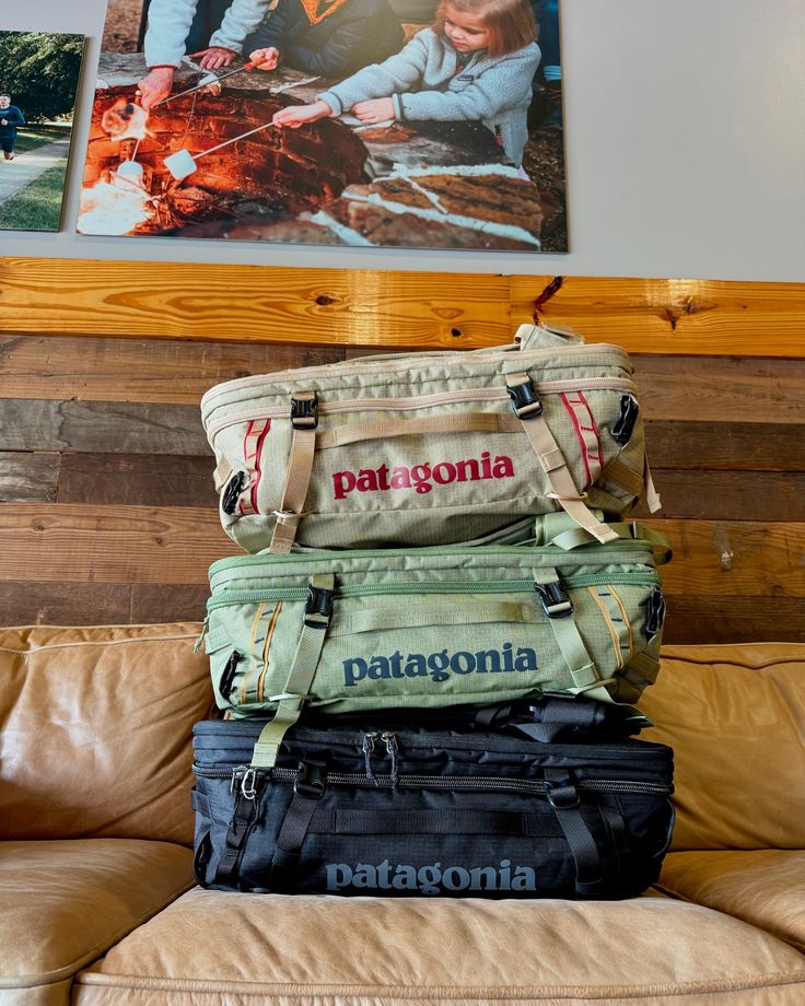 a stack of luggage sitting on top of a couch