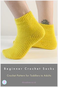 the legs and ankles of a woman wearing yellow socks with text overlay that reads, beginner crochet socks crochet pattern for toddlers to adults