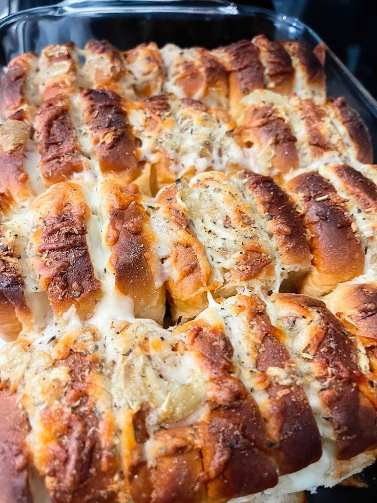 a casserole dish with cheese and meat in it