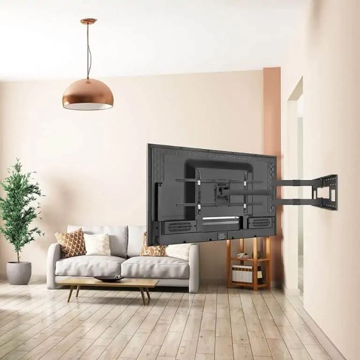 a living room with a large flat screen tv mounted to the wall