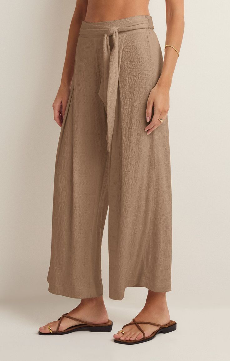 Take your casual look to the next level with the elevated, wide leg Isla Pucker Knit Pant. This pull on style features flattering details that will make this a pant you reach for on repeat. Chic Solid Color Loungewear Bottoms, Chic Solid Color Lounge Bottoms, Chic Loungewear Pants In Solid Color, Chic Solid Color Loungewear Pants, Chic Solid Color Pants For Loungewear, Chic Relaxed Fit Wide Leg Pants In Solid Color, Effortless Wide Leg Pants For Loungewear, Chic Relaxed Fit Solid Color Wide Leg Pants, Effortless Beige Bottoms