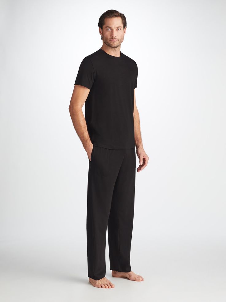 The ideal loungewear companion, the black trouser fastens with an elastic and tie waistband for a winning combination of comfort and flattering fit. The two front side pockets and a rear back pocket help to keep your phone and essentials close while you're lounging, while the black colour makes them easy to pair with our matching lounge t-shirts and hoodies. Our Basel fabric has to be touched to be believed. It offers long-lasting softness and doesn't pill, making it able to withstand countless Black Pants With Straight Hem For Loungewear, Black Loungewear Pants With Straight Hem, Black Straight Leg Sweatpants For Lounging, Black Wide Leg Pants For Lounging, Black Straight Pants For Loungewear, Black Lounging Pants Full Length, Black Sweatpants With Straight Hem For Work, Black Loungewear Pants, Black Sweatpants With Side Pockets And Straight Hem