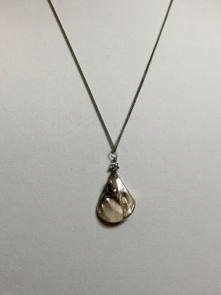 "Available in 16\", 18\" Sea shell pendant silver stainless stainless curb chain necklace, ornate with a 5mm silver plated alloy metal flower bead. Hand made jewelry! All purchase will arrive in gifts boxes. Thanks for stopping by!" Silver Shell Necklace With Pearl Pendant, Silver Shell Necklace With Pearl Pendant As Gift, Sterling Silver Shell Pendant Necklace As Gift, Silver Mother Of Pearl Shell Necklace As Gift, Silver Shell Pendant Necklace For Gift, Silver Pendant Shell Necklace Gift, Silver Mother Of Pearl Shell Necklace With Pearl Pendant, Silver Sterling Silver Shell Pendant Necklace, Silver Sterling Silver Pendant Shell Necklace