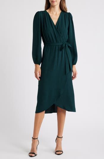 Show off contemporary style in this gracefully draped faux-wrap dress featuring puffed balloon sleeves and a removable tie belt. 48" length (size 8) Slips on over head Surplice V-neck Long sleeves with elastic cuffs Removable tie belt Unlined 100% polyester Machine wash, tumble dry Imported Model stats: 5'10" height, 32" bust, 25" waist, 36" hip. Model is wearing size 4. Fall Wedding Guest, Long Sleeve Wrap Dress, Wrap Midi Dress, Faux Wrap Dress, Free Fabric, Balloon Sleeves, Womens Midi Dresses, Tie Belt, Nordstrom Dresses